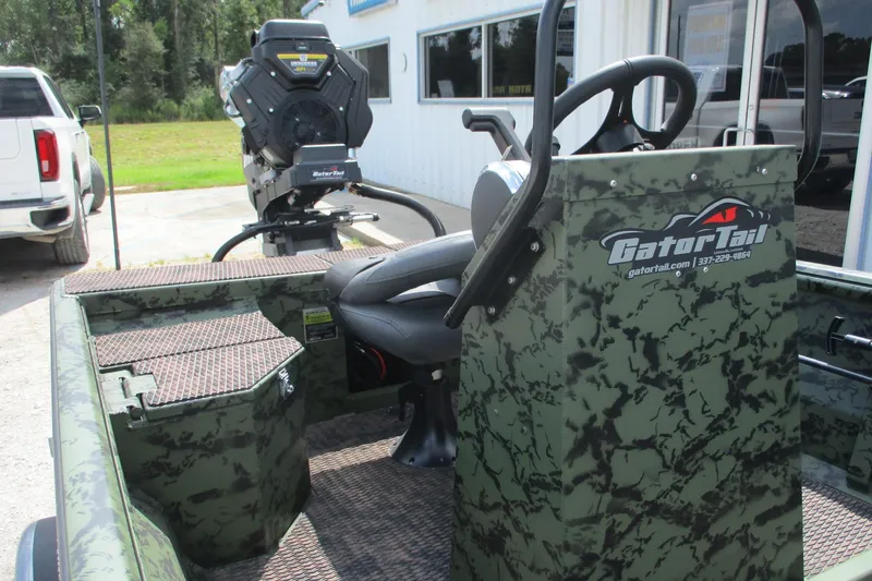 Slide: The Image of 2026 Gator Tail 1860 Extreme CC boat with camo design and central console. - 7