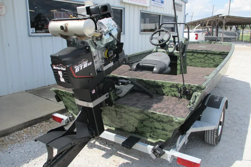 Slide: The Image of 2026 Gator Tail 1860 Extreme CC boat with camo design and powerful outboard motor. - 9