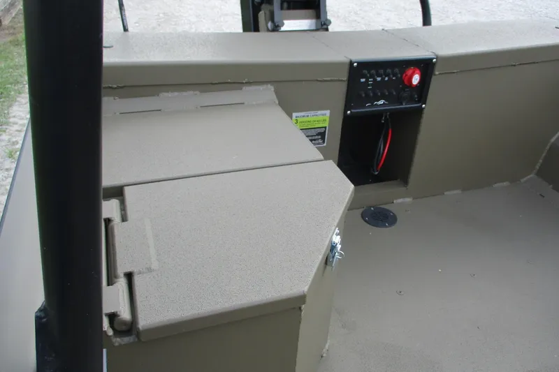Slide: The Image of 2026 Gator Tail 1748 GATOR boat interior with control panel and storage compartments. - 11