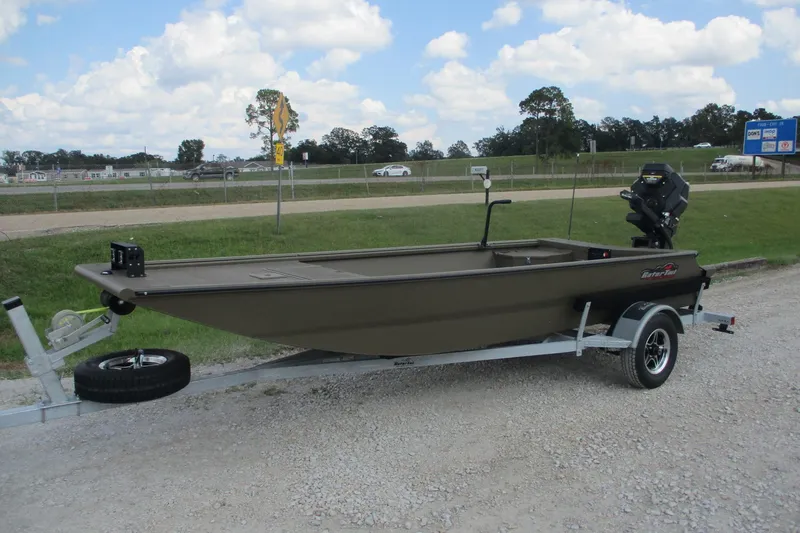Slide: The Image of 2026 Gator Tail 1748 GATOR boat on trailer, parked outdoors under cloudy sky. - 2
