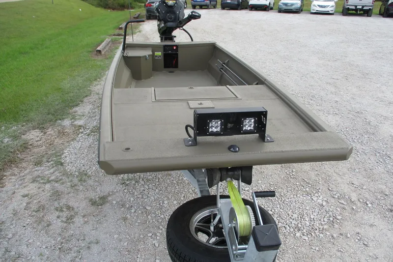 Slide: The Image of 2026 Gator Tail 1748 GATOR boat on trailer, parked on gravel lot. - 5