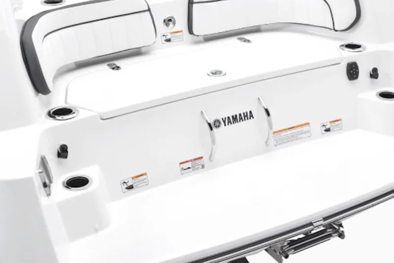 Slide: The Image of 2026 Yamaha Boats 252 FSH Sport, rear seating and deck area, white with cup holders. - 4