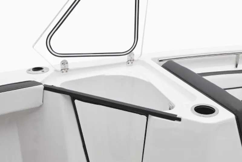 Slide: The Image of 2026 Yamaha Boats 252 FSH Sport interior storage compartment with open lid and seating. - 5
