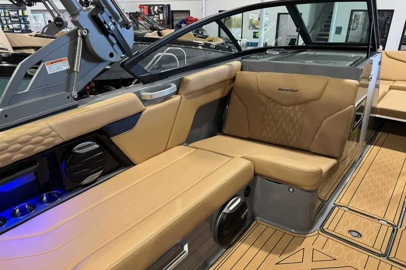 Slide: The Image of 2026 MasterCraft XT22 boat interior with tan leather seating and modern design. - 4