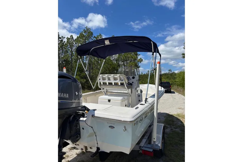 Slide: The Image of 2021 Key West 188 Bay Reef boat on trailer, with Yamaha engine, under blue sky. - 4
