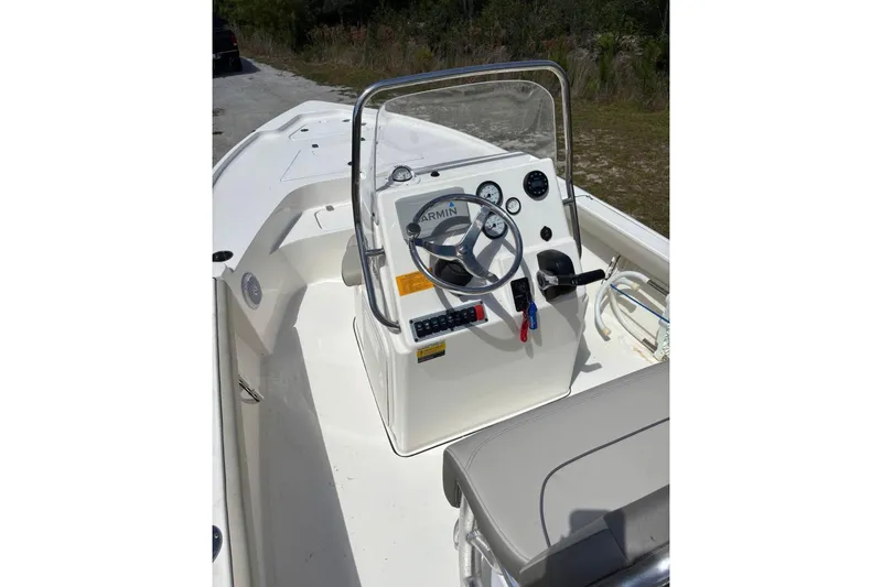 Slide: The Image of 2021 Key West 188 Bay Reef boat interior with steering console and seating. - 5