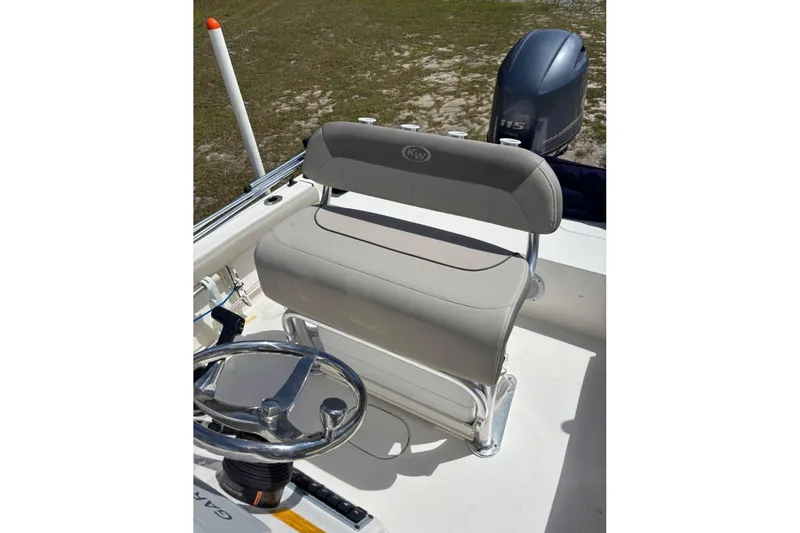 Slide: The Image of 2021 Key West 188 Bay Reef boat interior with steering wheel and seating. - 6