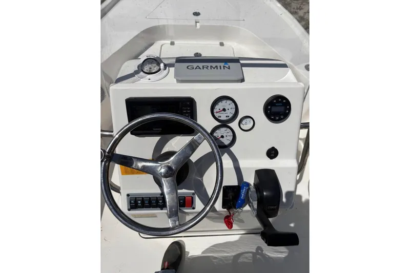 Slide: The Image of 2021 Key West 188 Bay Reef boat dashboard with Garmin navigation system and steering wheel. - 8