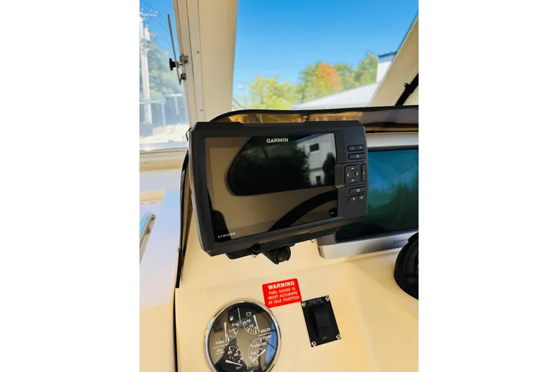 Slide: The Image of 2006 Mainship Pilot 30 Sedan helm with Garmin navigation system and gauges. - 11