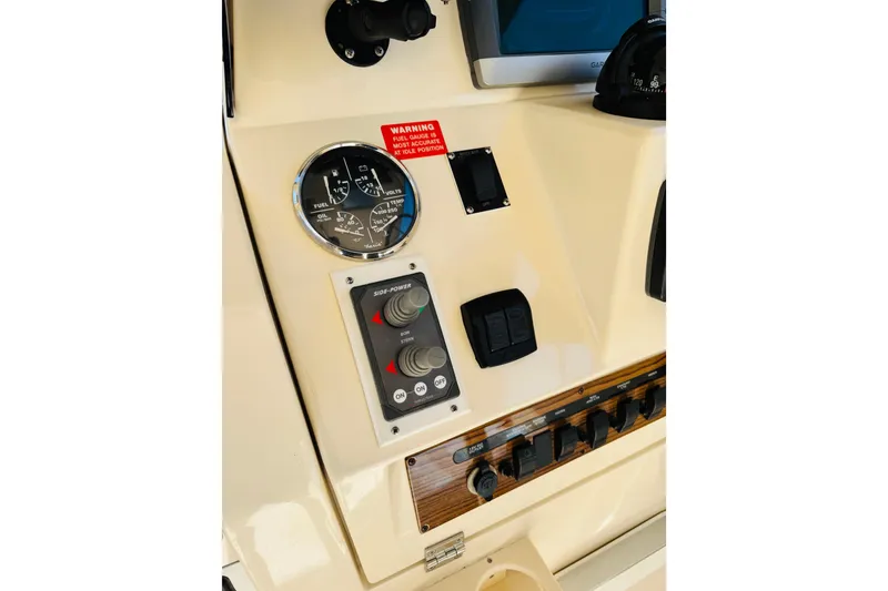 Slide: The Image of 2006 Mainship Pilot 30 Sedan dashboard with gauges and controls. - 12