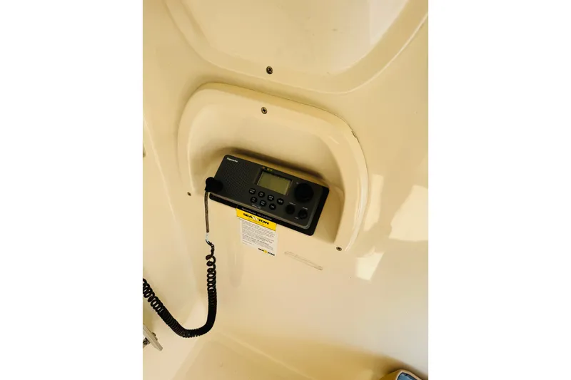 Slide: The Image of 2006 Mainship Pilot 30 Sedan radio system with coiled microphone cable. - 14