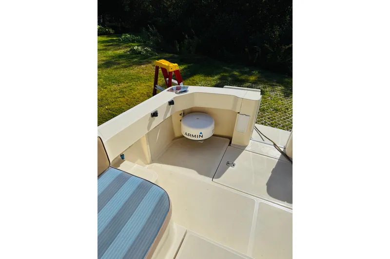 Slide: The Image of 2006 Mainship Pilot 30 Sedan deck with Garmin equipment and outdoor seating. - 20