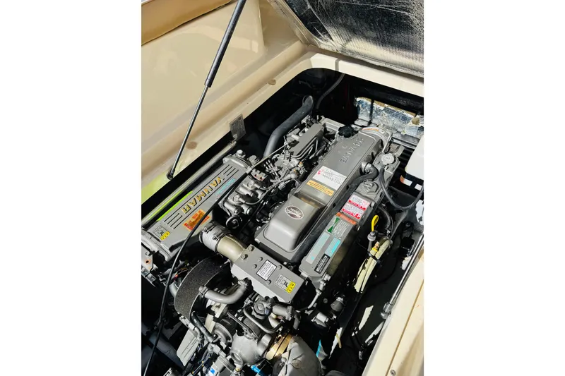 Slide: The Image of Engine compartment of a 2006 Mainship Pilot 30 Sedan, featuring a Yanmar engine. - 24