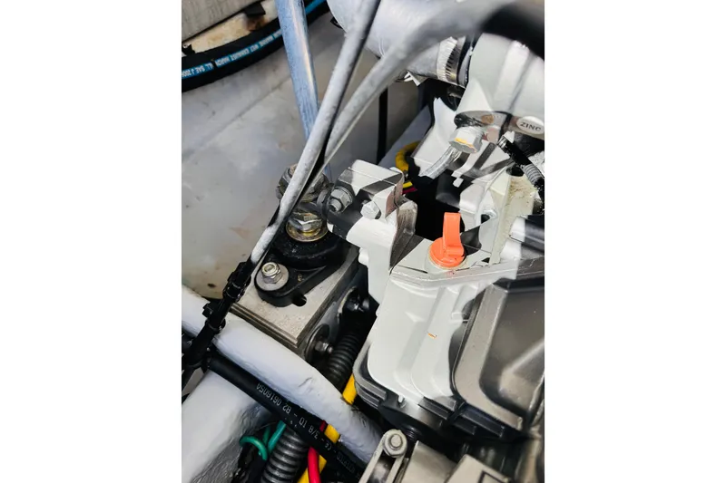 Slide: The Image of Engine components of a 2006 Mainship Pilot 30 Sedan boat, featuring detailed mechanical parts. - 26