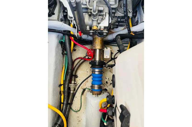 Slide: The Image of Engine compartment of a 2006 Mainship Pilot 30 Sedan with visible wiring and components. - 29