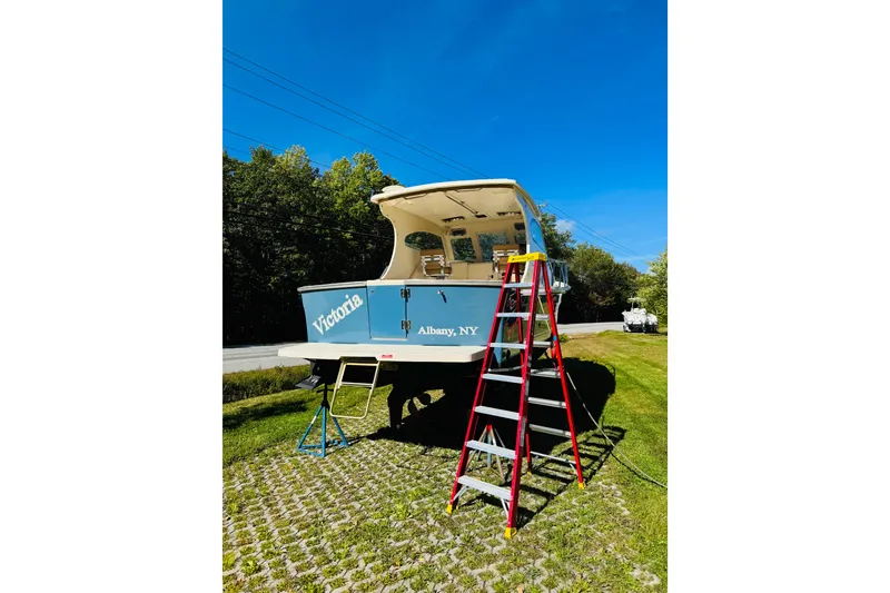 Slide: The Image of 2006 Mainship Pilot 30 Sedan boat on land with ladder, Albany, NY. - 31