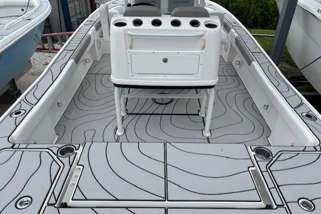 Slide: The Image of 2023 Caymas 26 HB boat interior with modern design and ample storage. - 13