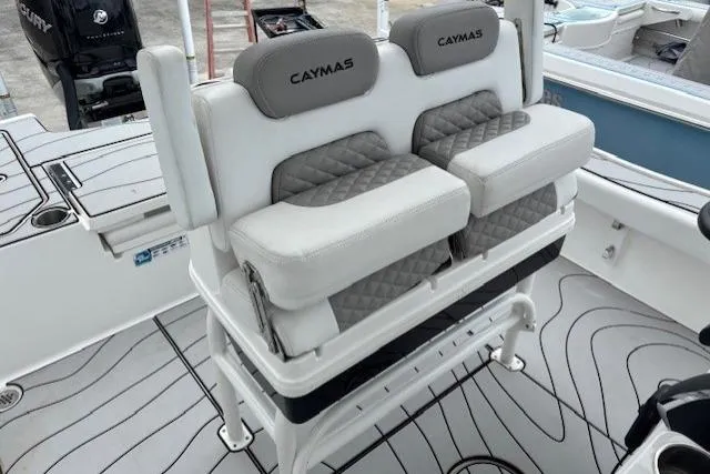 Slide: The Image of 2023 Caymas 26 HB boat seating with cushioned backrests and modern design. - 15