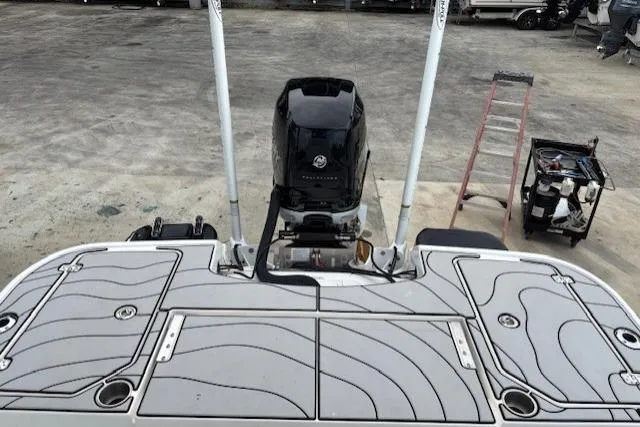 Slide: The Image of 2023 Caymas 26 HB boat with outboard motor and deck view. - 22