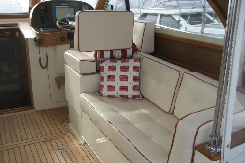 Slide: The Image of Luxurious interior of 2007 Legacy Yachts 32 with plush seating and nautical decor. - 12