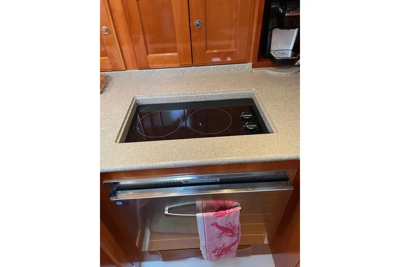 Slide: The Image of Modern yacht kitchen with electric cooktop and oven, Legacy Yachts 32, 2007 model. - 27