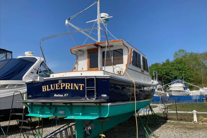 Slide: The Image of 1993 Flye Point 31 boat named "Blueprint" on land, Montrose, NY. - 3