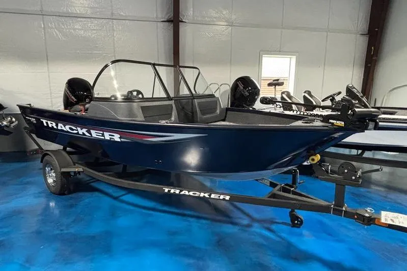 The Image of 2026 Tracker Pro Guide V-16 WT boat on display in showroom. - 2