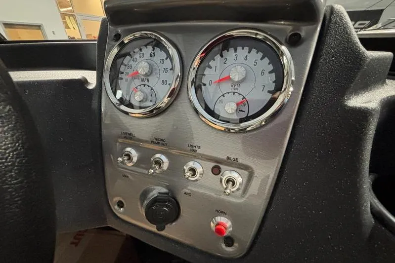 Slide: The Image of Dashboard of 2026 Tracker Pro Guide V-16 WT boat with gauges and switches. - 6