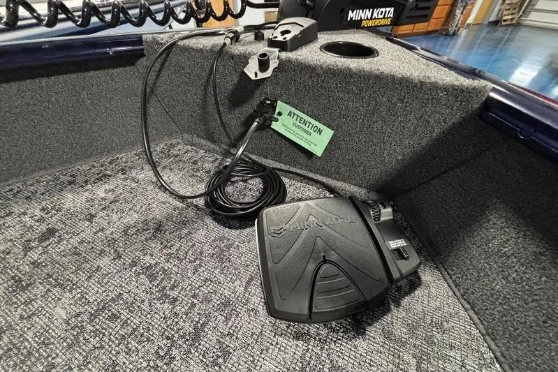 Slide: The Image of 2026 Tracker Pro Guide V-16 WT boat interior with Minn Kota foot pedal and wiring. - 8