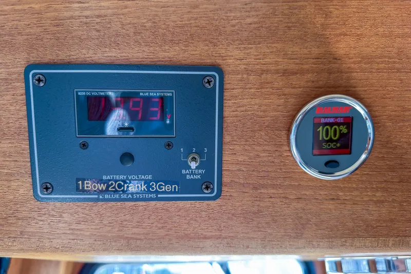 Slide: The Image of Battery voltage display on 1999 Nordic Tug 37, showing 79.3 volts and 100% charge. - 21