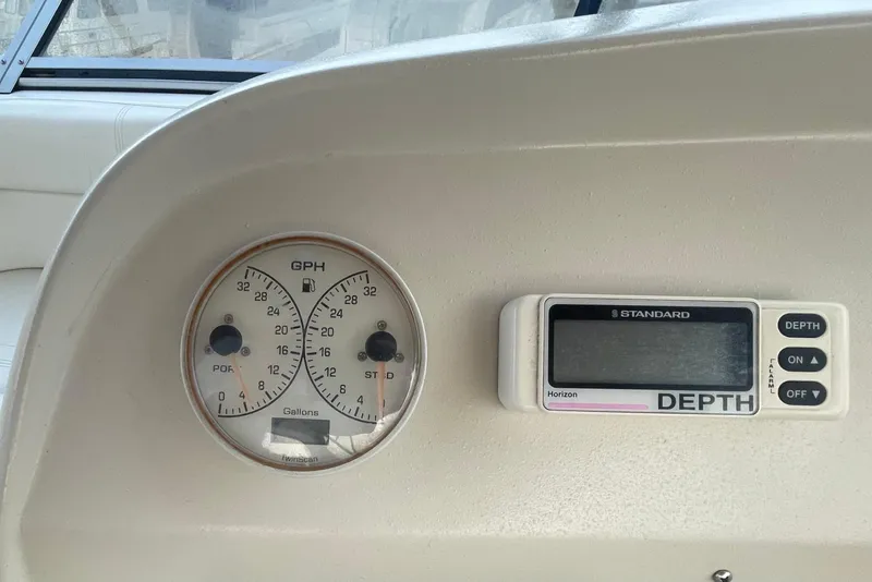 Slide: The Image of Instrument panel of 1997 Cruisers Yachts 3650 Aft Cabin with fuel and depth gauges. - 11