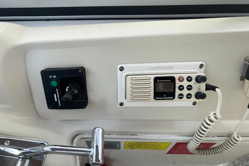 Slide: The Image of Control panel of a 1997 Cruisers Yachts 3650 Aft Cabin with radio and joystick. - 12