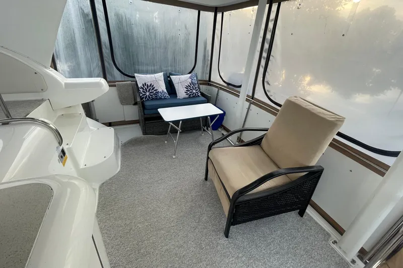 Slide: The Image of 1997 Cruisers Yachts 3650 Aft Cabin interior with seating and table. - 13