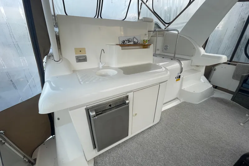 Slide: The Image of 1997 Cruisers Yachts 3650 Aft Cabin interior with kitchenette and sink. - 15