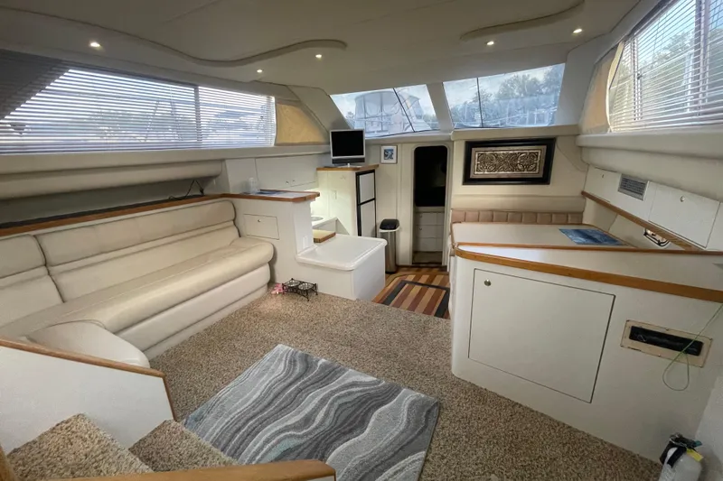 Slide: The Image of 1997 Cruisers Yachts 3650 Aft Cabin interior with plush seating and modern decor. - 19