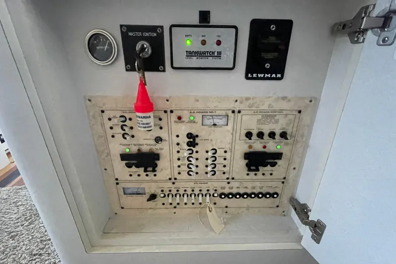 Slide: The Image of Electrical control panel of 1997 Cruisers Yachts 3650 Aft Cabin with ignition and power switches. - 29