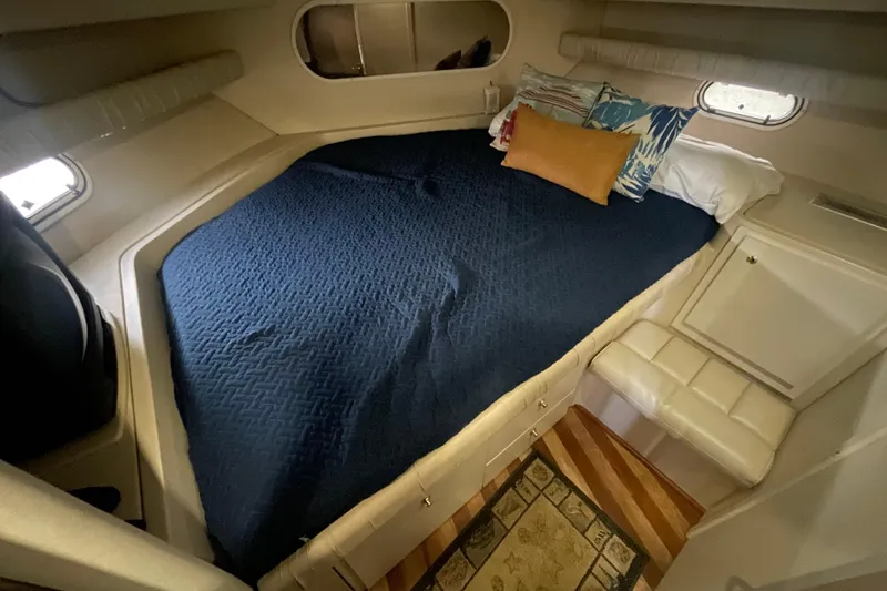 Slide: The Image of 1997 Cruisers Yachts 3650 Aft Cabin interior with cozy bed and decorative pillows. - 35