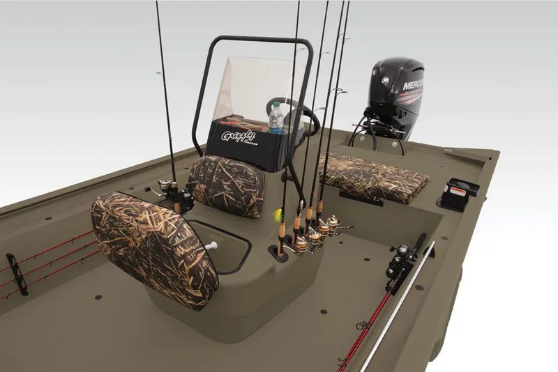 Slide: The Image of 2019 Tracker Grizzly 1860 CC boat interior with fishing rods and camo seats. - 14