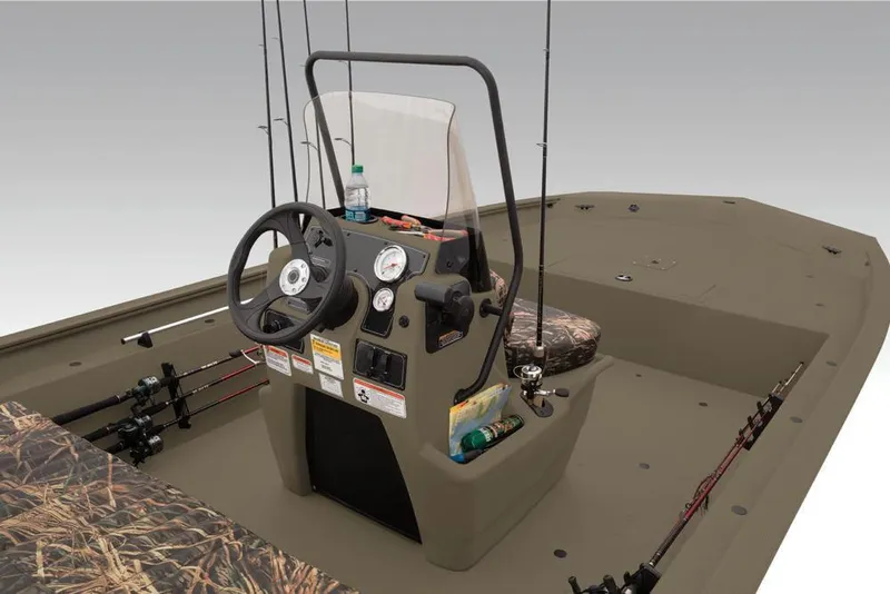 Slide: The Image of 2019 Tracker Grizzly 1860 CC boat interior with steering console and fishing rods. - 19