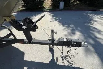 Slide: The Image of Trailer hitch of 2019 Tracker Grizzly 1860 CC boat on concrete surface. - 2