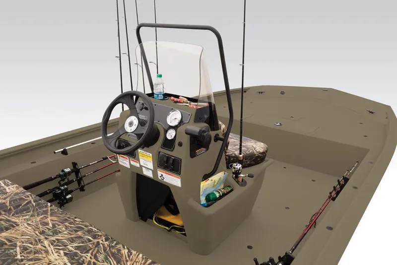 Slide: The Image of 2019 Tracker Grizzly 1860 CC boat interior with steering console and fishing rods. - 23