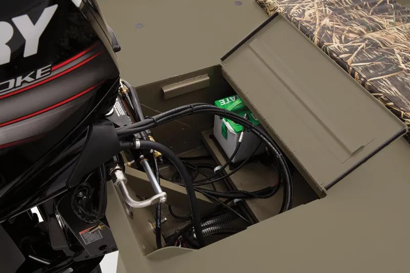 Slide: The Image of 2019 Tracker Grizzly 1860 CC boat engine compartment with battery and wiring. - 24