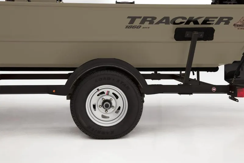 Slide: The Image of 2019 Tracker Grizzly 1860 CC boat trailer with visible wheel and branding. - 26