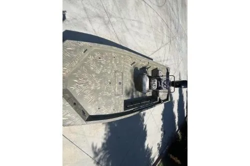 Slide: The Image of 2019 Tracker Grizzly 1860 CC boat on concrete surface, aerial view. - 6