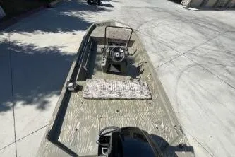 Slide: The Image of 2019 Tracker Grizzly 1860 CC boat on concrete surface, top view. - 7