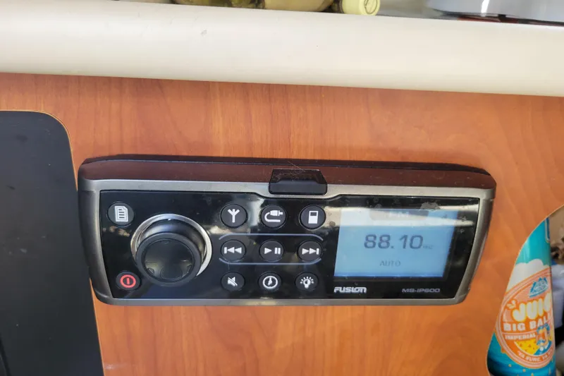 Slide: The Image of Fusion MS-IP600 stereo system on a 2003 Bayliner 245 boat dashboard. - 21