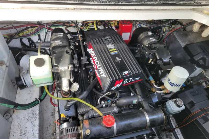 Slide: The Image of Engine compartment of a 2003 Bayliner 245 with a Mercury 5.7L V8 engine. - 32