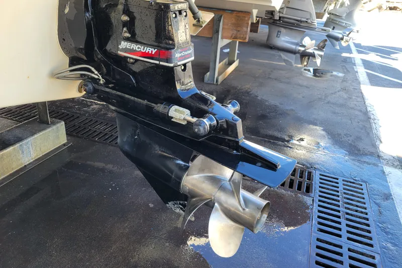 Slide: The Image of 2003 Bayliner 245 boat with Mercury MerCruiser outboard motor and propeller. - 37