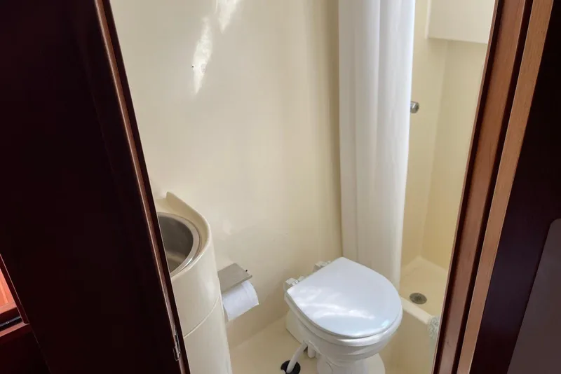 Slide: The Image of Luxurious interior of 2005 Mariner 38 Orient yacht with cozy seating and elegant wood finish. - 10