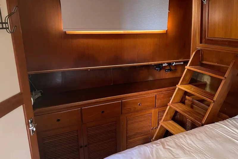 Slide: The Image of Luxurious interior of 2005 Mariner 38 Orient yacht with leather seating and wooden accents. - 13